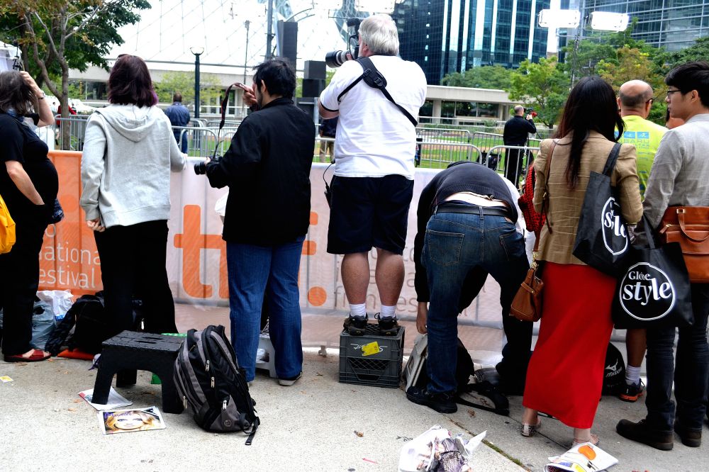 People at the front standing on platforms