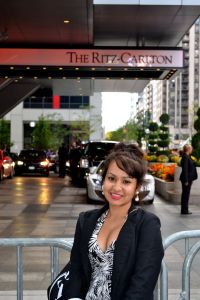 Standing in front of the Ritz-Carlton