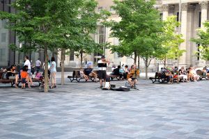 Old Montreal Cobble stone opening for people to relax