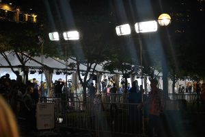 Fans and reporters eagerly await the perfect shot