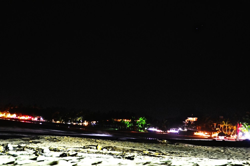 Beach Bars illuminate the beach at night with vibrant colours. A very alluring invitation to join the party.