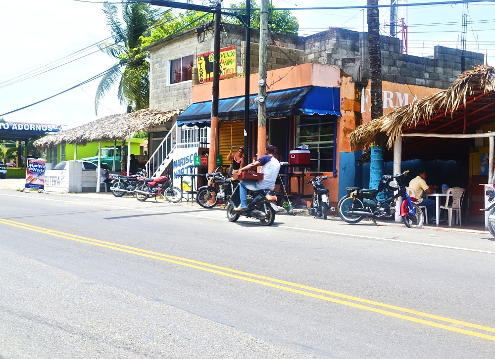 Local shops and scooters line the streets 
